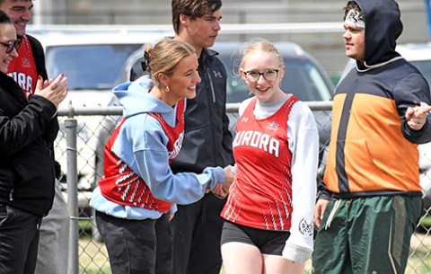 Sofia Van Veldhuizen (left) congratulates her sister Adelyn, after she competed in the Unified Track shot put competition at the Central City Invite on Friday. The sisters along with Lakota Von Ohlen and Ava Paulson placed second in the girls 4x100 relay race. 