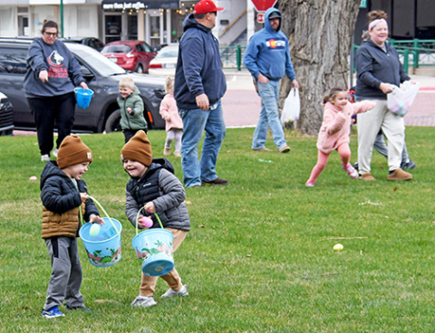 A pair of young boys express their delight at finding lots of Easter eggs at the courthouse Saturday afternoon.