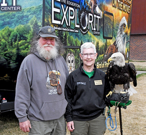 Virginia wildlife rescuer Tommy White and Edgerton raptor specialist Deb Miller pose with bald eagle Aquilla in front of the Explorit Center’s new raptor trailer. White had just delivered a barred owl and red-shouldered hawk rescued by his organization to add to the Edgerton’s raptor education program. 