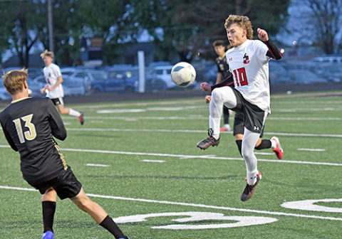 Aurora’s Ian Jensen makes quick work on his feet to move the ball downfield during the Huskies’ 6-2 loss at Northwest last week.