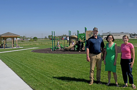 Pictured above are, from left, Jeremy Cattau, Jannelle Seim and Emily Jasnowski, all of whom helped coordinate the project to construct the new pocket park in the Streeter Subdivision. 