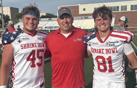 Wade Miller, a 2002 Aurora graduate now serving as an assistant coach in Seward, was an assistant coach for the South team in Saturday’s Shrine Bowl. He celebrated after the game with former Huskies Collin Stolpe and Canon Allen.