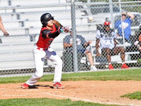 Keagan White lays down a bunt during Aurora’s win over Gering. White had three RBIs in the win. 
