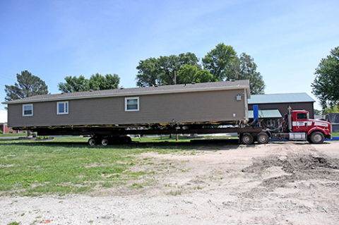 Little Stingers Childcare had its two modulars relocated to the lot south of Giltner Elementary School last week to expand its facilities in order to meet the growing needs for children and staff. Little Stingers will be hosting a womens nine-hole golf scramble on June 12 to raise money for the ongoing construction and facility needs.