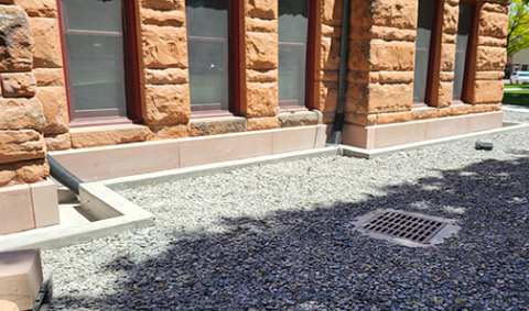 The sandstone base blocks along the west side of the Hamilton County Courthouse have been replaced with new ones cut from the same Colorado quarry.