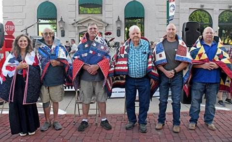 The six veterans recognized at a Quilts of Valor ceremony during A’ROR’N Days Friday night were from left: Amy Lou Emaneul-Bassett, Paul G. Duey, Richard Hock, Bruce Nilson, Jason Trumble and Jeff Trumble.