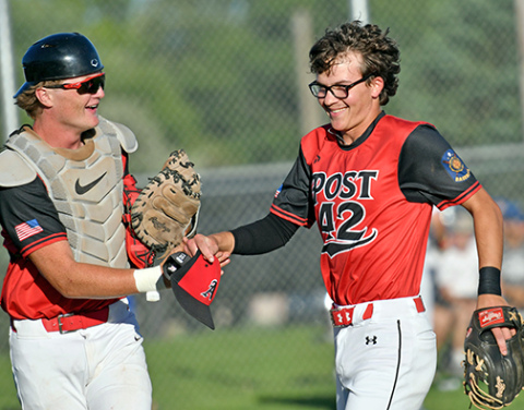 ukas Fry (right) and Dylan Ronnau share a laugh coming off the field during a game earlier this season. Fry has pitched 18 innings this season for the Pinnacle Bank Seniors, the most on the team. 