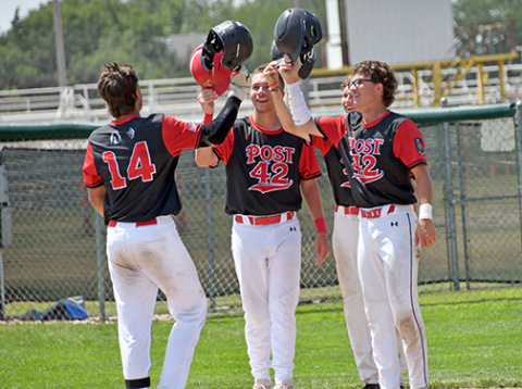 Sawyer Kiner is met at the plate by Jace Dorsey, Jack Carstensen and Lukas Fry after his grand slam during Aurora’s 13-5 win over Overton in Saturday’s elimination game at the Area 6 tournament in Holdrege. 