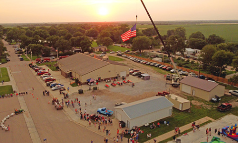 Old Glory flies high above the Phillips Memorial Hall Friday evening as the community came together to celebrate America’s 250th birthday. 