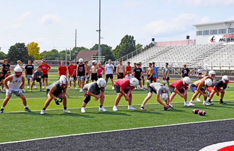 The Aurora Husky football team holds its afternoon workout on Monday. 