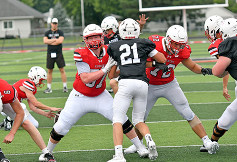 Gabe Gibson (57) and Tucker Theriot (72) work on extra point protection.