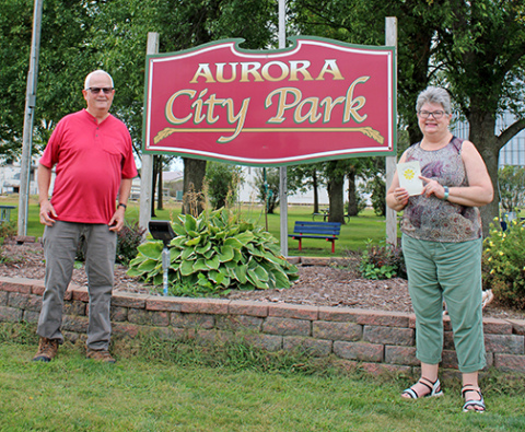 The first stop on Tom and Patti Kell’s trip in the fall of 2025 to visit towns named Aurora was Aurora, S.D., where they had this picture taken of them at the city park. South Dakota’s Aurora is near Brookings and close to the Minnesota border. 