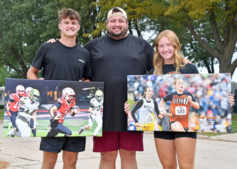 Aurora’s Canon Allen (left) and Giltner’s Avery Reeson were selected as the Aurora News-Register’s athletes of the year for the 2024-25 sports season. Allen and Reeson pose for a photo with ANR sports editor Richard Rhoden. 