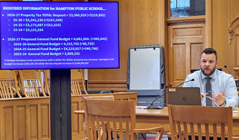 Hampton School Supt. Carson Klute explains the reasons for the districts 2026-27 property tax asking increase at a public hearing Monday night. 