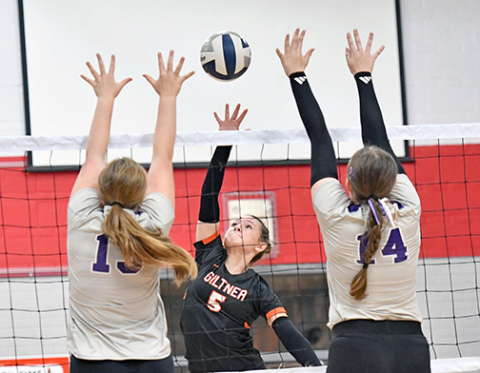 Giltner’s Reese Rudy splits two Axtell blockers as the Hornets downed the Wildcats in two sets last week. 