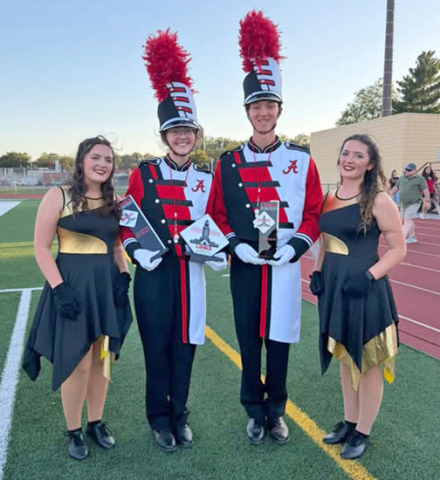 Pictured from left are: color guard co-captain Adelynne Hendrickson, drum majors Tajel Lents and Rylan Salmon and color guard co-captain Abigail Hendrickson.