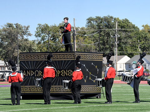 Many spectators were drawn by the visuals as much as Pandora’s Box as Aurora performed at Harvest of Harmony. That afternoon, the band took home its first superior of the season in the Class B field show. Pictured performing in the field show are from left: Ashlyn Yockey, Kinslea Johnson, Landrie Champion and Lucy Johnson.