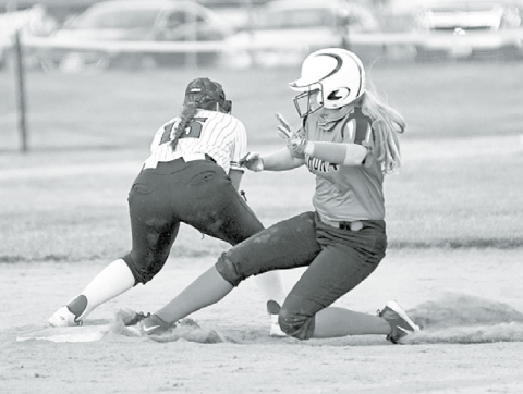 Above: Lauryn Thomas slides safely into second base following a base hit. At right, Rylee Olsen had a three-run homer and pitched a one-hit shutout in a 17-0 win at Centennial. News-Register/Richard Rhoden