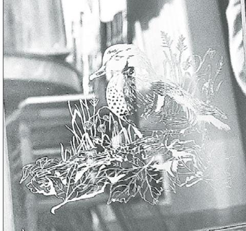 An etching of a woodland duck created for Larry Robert’s father showcases the details in each of his pieces. News-Register/Jeni Moellenberndt