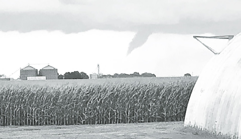 A funnel cloud forming near Hampton was photographed by Tessa Glinsmann. Her family’s acreage suffered damages from the Friday night storm. Courtesy photo