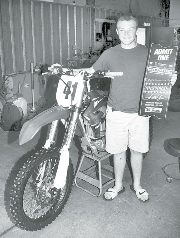 Karson Meyer, an Aurora sophomore, holds the ticket he earned to this week’s Amateur National Motocross Championship at Loretta Lynn’s Ranch in Tennessee. News-Register/Kurt Johnson