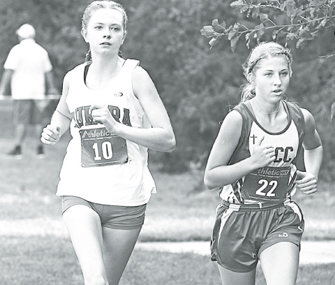 Elena Kuehner works to take and hold the first-place position during the GINW Invite. She was able to keep the lead for over half of the race. News-Register/Jeni Moellenberndt