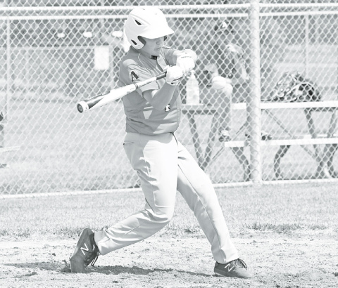 Above: Aurora Cooperative Red’s Chase Phillips blasts one of his two-run RBI doubles during a 10-4 win over Pinnacle Bank White Sunday afternoon. Phillips totaled four RBIs in the game. At right, PB White’s Brady Collingham came in as a relief pitcher Sunday, tossing 1-1/3 innings with three strikeouts and two allowed hits. News-Register/Richard Rhoden