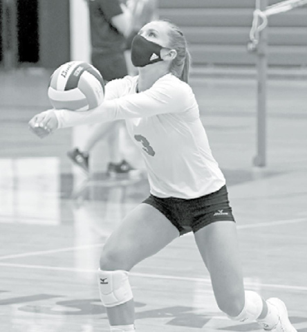 Cassidy Knust wears a mask during volleyball practice last week, something the team, led by the seniors, decided to do. News-Register/Richard Rhoden