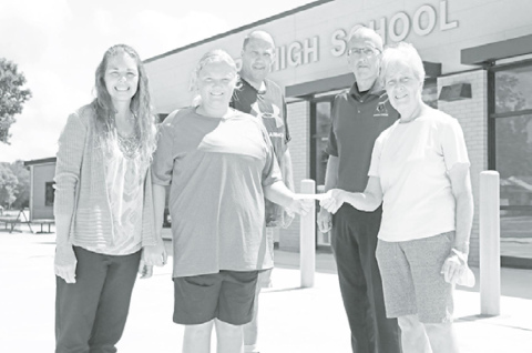 It was a special occasion as recent Husky grad Jessica Wert received a scholarship from the Aurora Alumni Association. Those present for the check presentation were, from left: Christy Wert, Jessica Wert, Jeff Wert, Aurora High School Principal Doug Kittle and Sandy Howland of the Aurora Alumni Association. News-Register/Cheyenne Rowe