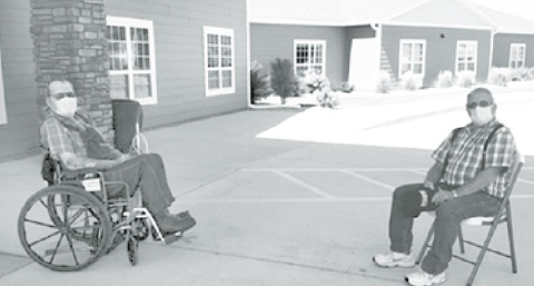 Westfield resident Marion Dittmer, left, visits outside in front of the facility with his brother, Larry. Family visits were just recently allowed at Westfield Courtesy photo