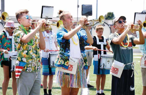 Fully embracing Thursday’s “beach day” theme for Aurora’s 2020 band camp were, from left, trumpeters Cole Krejci (9), Emi Huls (9) and Wyatt James (10). News-Register/Cheyenne Rowe