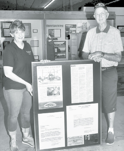 Plainsman Director Tina Larson (left) was on hand to accept this historical donation on behalf of late Hordville native Junior Nelson by his friend Shorty Hahn. News-Register/Kurt Johnson