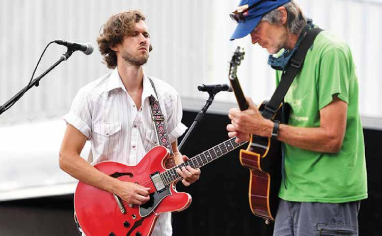 Myles Jasnowski, left, and Bill Whitney provided local musical talent during the Bands on the Bricks finale Friday night on the downtown square. News-Register/Kurt Johnson