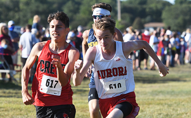 Max Wiarda gives one last push at the finish line during the Seward Invite to hold his position against the field. News-Register/Jeni Moellenberndt