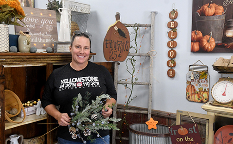 Beth Caldwell stands among her fall decor pieces in her new store Cinnamon Hearts decor and Sun Kissed Tanning in Hampton. News-Register/Jeni Moellenberndt