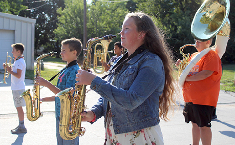 From left, Haden Helgoth, Hudson Urkoski, Allie Howell and Kaden Rieken stand in formation during marching practice. Courtesy photo