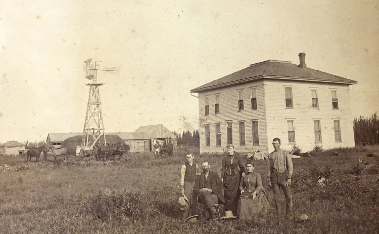 The caption below this original photo reads ‘A.J. McConaughey and family first custodian of the Hamilton County Poor Farm, Section 22, Orville Precinct 1884-1892.’ Those pictured are, from left: B. E. McConaughey, A. J. McConaughey, May (Mrs. May Fowler) McConaughey, Mrs. A. J. (Drussila) McConaughey and Ora T. McConaughey. Mr. James Bird is in the wagon on the left.