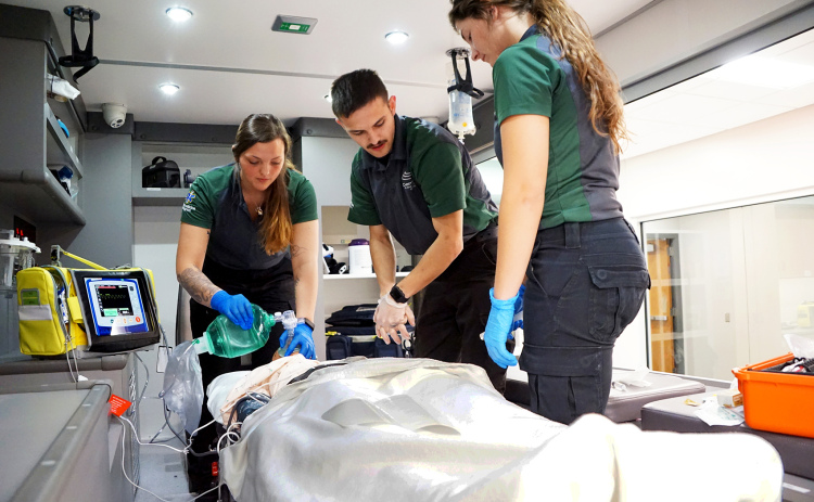 Central Community College paramedicine students treat a patient simulator in a photo taken pre-pandemic. Cheyenne Massey, left, is a CCC graduate who now works full-time for the Aurora Fire Department.