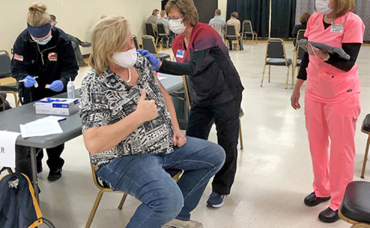 Matt Messner of Polk gave the thumbs up Thursday as he received his COVID-19 vaccination during an MCHI clinic at the Bremer Center.