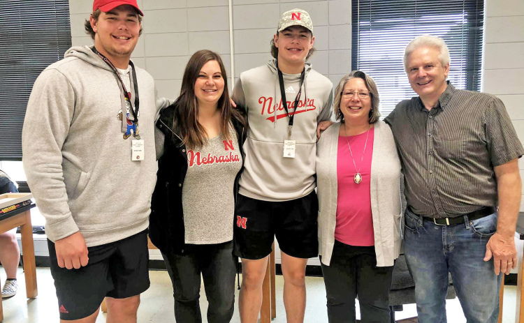 Ian Boerkircher (left) visited his sister Abbie Woodward along with other brother Nate Boerkircher. Stopping by to snap a picture with the Husker players were fellow Aurora alumni Kerry McBride and John Leininger.