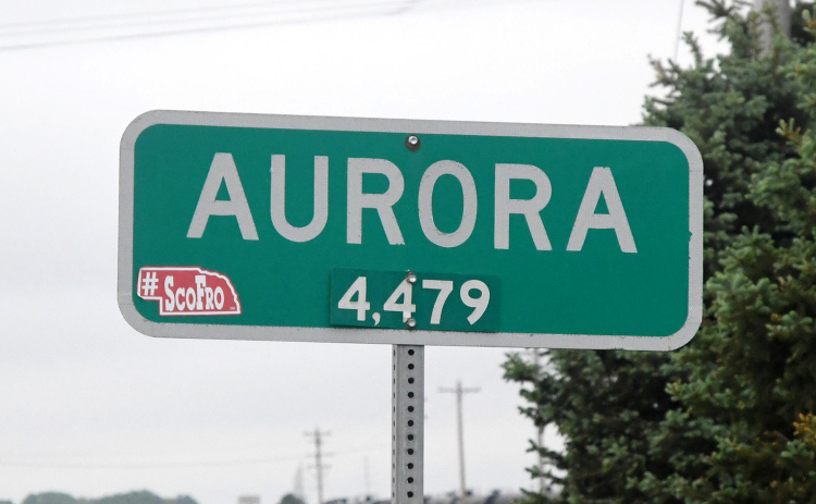 The sign posted on Highway 34 currently shows Aurora’s population at 4,479, though that is dated information. According to the 2020 Census, a tract including the city shows a population of 4,926. The report did not specifically break out Aurora’s total population.