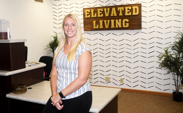 Devon Rasmussen had help from family members in remodeling the office space, and creating a new sign, for Elevated Living Chiropractic.