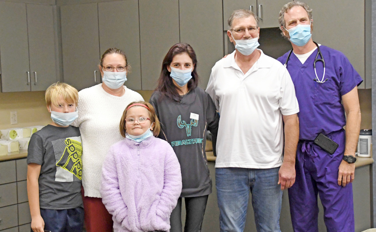 Rick Hock (second from right) celebrated with his family and caretakers during a Nov. 9 event. Those pictured include from left: Kayden Ehlers, Chris Hock, Serenity Halsey, Alicia Hock, Rick, Dr. Erich Fruehling.
