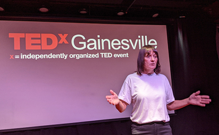 Mary Ingram of Phillips is shown speaking on a TED stage this June in Gainsville, Fla. Her message challenges her audience to put a more positive light on community service as a useful tool for young people.