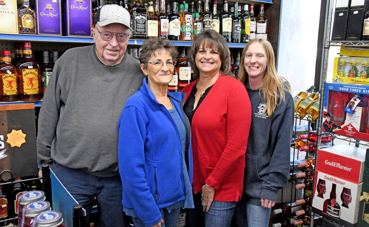 Larry and Theresa Naeve, left, sold T&L Convenience & Liquor to their daughter Lori Meyer and her husband Brian, (not pictured) who are now co-owners and partners with store manager Missy Kliewer, pictured at right.
