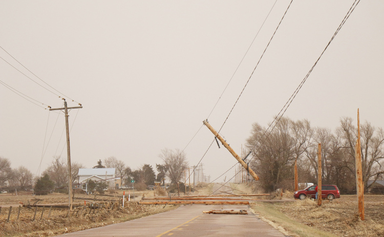 Several power poles were downed across the county in last week’s storm, including on 6 Road east of Giltner.