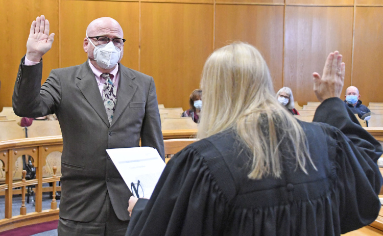 Doug Dexter is sworn in Thursday as Hamilton County’s new deputy county attorney by Dist. Judge Rachel Daugherty.