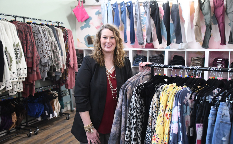 Kelsey Hofmann showcases women’s clothing available through her Urban Chic Boutique business, when she recently converted from a mostly online venture to a downtown local sharing space with Honeysuckle Lane.