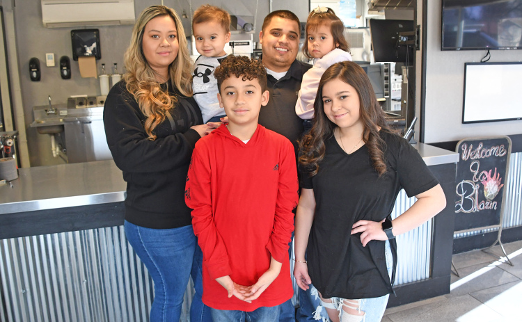 Ernesto Franco, pictured here with his wife Karen and children Victoria, Brayden, Aliana and Ayden, has announced plans to open Blazin’ Wings N More at 850 Q St., in Aurora.