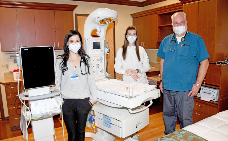 Pictured from left, OB doctors Jennifer Harney, Alexis Erbst and Jeff Muilenburg stand in a room previously used as a birthing suite. Much of the equipment remains after a transition to a shared care model, giving  OB physicians tools needed for prenatal and postnatal care for moms and babies.